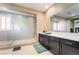 Bathroom featuring a spacious walk-in shower with pebble flooring and tile surround at 2575 Hazelburn Ave, Henderson, NV 89044