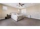 Spacious bedroom featuring a ceiling fan and a comfortable-looking bed with neutral decor at 2575 Hazelburn Ave, Henderson, NV 89044