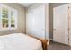 Well-lit bedroom with closet, window and plush carpet flooring provides ample storage and comfort at 2575 Hazelburn Ave, Henderson, NV 89044