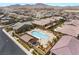 Aerial view of a neighborhood pool with ample seating and manicured landscaping at 2575 Hazelburn Ave, Henderson, NV 89044