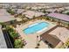 Aerial shot of a community pool with lounge chairs, cabanas, and manicured landscaping at 2575 Hazelburn Ave, Henderson, NV 89044
