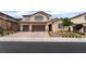 Charming two-story stucco home features a three-car garage and well-manicured landscaping at 2575 Hazelburn Ave, Henderson, NV 89044