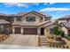 Beautiful two-story home featuring a tiled roof, three-car garage, and professionally landscaped front yard at 2575 Hazelburn Ave, Henderson, NV 89044