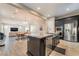 Kitchen with dark wood cabinets, stainless steel appliances, an island, and granite countertops at 2575 Hazelburn Ave, Henderson, NV 89044