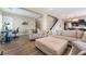 Open living room with comfortable seating, hardwood floors, and neutral paint at 2575 Hazelburn Ave, Henderson, NV 89044