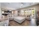 Open living room with sliding doors, a comfortable couch, and hardwood floors at 2575 Hazelburn Ave, Henderson, NV 89044