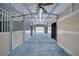 Interior view of barn featuring stalls, ceiling fan and open entrance at 2851 Winchester Ave, Pahrump, NV 89048