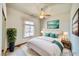 Cozy bedroom with a comfortable queen bed and a ceiling fan at 2851 Winchester Ave, Pahrump, NV 89048