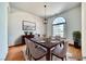Formal dining room featuring hardwood floors, natural light, and modern chandelier at 2851 Winchester Ave, Pahrump, NV 89048