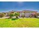 Charming single-story home with a well-manicured lawn and colorful flowering bushes at 2851 Winchester Ave, Pahrump, NV 89048