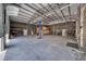 Interior of the large garage, featuring concrete floors and vehicle lift at 2851 Winchester Ave, Pahrump, NV 89048