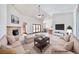 Large living room with stone fireplace, high ceilings, and comfortable seating at 2851 Winchester Ave, Pahrump, NV 89048