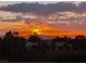 Panoramic mountain views at sunset with orange and yellow skies over the Las Vegas Valley at 3032 Highland Falls Dr, Las Vegas, NV 89134