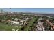 Picturesque aerial view of a golf course community with tree-lined streets, situated near the city at 3111 Bel Air Dr # 28A, Las Vegas, NV 89109