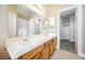 Well-lit bathroom boasts a double sink vanity, tile floors and neutral color palette at 3312 Speckle Summer Pl # 3, North Las Vegas, NV 89084