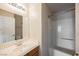 Bathroom with a single sink vanity, large mirror, and a bathtub with a shower at 3312 Speckle Summer Pl # 3, North Las Vegas, NV 89084