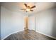 Nicely painted bedroom with hardwood floors, double door closet, and modern ceiling fan at 3312 Speckle Summer Pl # 3, North Las Vegas, NV 89084