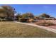 Landscaped common area with mature trees and picnic tables creating a serene outdoor space at 3312 Speckle Summer Pl # 3, North Las Vegas, NV 89084