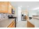 Bright kitchen with stainless steel appliances, a tiled backsplash, and tiled floors at 3312 Speckle Summer Pl # 3, North Las Vegas, NV 89084