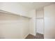 Bright, carpeted walk-in closet featuring shelving and plenty of hanging space at 3312 Speckle Summer Pl # 3, North Las Vegas, NV 89084
