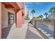 Large balcony offering outdoor living space with views of palm trees at 35 E Agate Ave # 208, Las Vegas, NV 89123