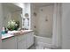 Bright bathroom features double sinks and a shower-tub combination at 35 E Agate Ave # 208, Las Vegas, NV 89123