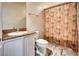 Bathroom featuring vanity with granite countertop and shower with patterned curtain at 35 E Agate Ave # 208, Las Vegas, NV 89123