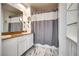 Bright bathroom with double sinks, granite countertop, shower with tub at 35 E Agate Ave # 208, Las Vegas, NV 89123