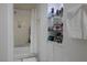 Clean bathroom with a shower-tub combination and built-in shelving at 35 E Agate Ave # 208, Las Vegas, NV 89123