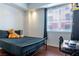 Bedroom featuring modern furniture and hardwood floors at 35 E Agate Ave # 208, Las Vegas, NV 89123