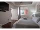 Relaxing bedroom with a large bed, neutral decor, and ample natural light at 35 E Agate Ave # 208, Las Vegas, NV 89123