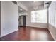 Bright dining area featuring hardwood floors, modern light fixture, and large windows at 35 E Agate Ave # 208, Las Vegas, NV 89123