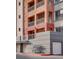 Striking exterior of a multi-story condo building with private balconies and attached garage at 35 E Agate Ave # 208, Las Vegas, NV 89123