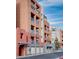 Modern condo buildings displaying private garages and multiple stories of outdoor balconies at 35 E Agate Ave # 208, Las Vegas, NV 89123