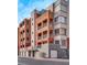 Attractive condo building featuring multiple floors, balconies, and well-maintained landscaping at 35 E Agate Ave # 208, Las Vegas, NV 89123