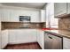 Kitchen with white cabinets, stainless appliances and a red sink at 35 E Agate Ave # 208, Las Vegas, NV 89123