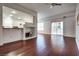 Open-concept living area with hardwood floors and sliding glass doors at 35 E Agate Ave # 208, Las Vegas, NV 89123