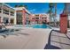 A luxurious outdoor pool with plenty of lounge seating and shade in a resort-style setting at 35 E Agate Ave # 208, Las Vegas, NV 89123