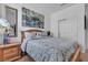 Cozy bedroom with wood frame bed, gray patterned bedding and decorative pillows at 3964 E Marathon Dr, Pahrump, NV 89061
