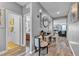 Charming hallway with gray walls, wood floors, seating, and decorative mirror at 3964 E Marathon Dr, Pahrump, NV 89061