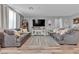 Spacious living room with comfortable seating, neutral walls, and a large television at 3964 E Marathon Dr, Pahrump, NV 89061