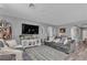 Bright living room includes a large sofa, entertainment center, and view of connecting rooms at 3964 E Marathon Dr, Pahrump, NV 89061
