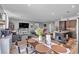 Open living space with dining area and a modern kitchen with a large island at 3964 E Marathon Dr, Pahrump, NV 89061