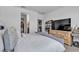 A comfortable main bedroom featuring neutral decor and a glimpse into the en-suite bathroom at 3964 E Marathon Dr, Pahrump, NV 89061