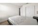 This is a bedroom with wood look floors and double closet at 4563 Townwall St, Las Vegas, NV 89115