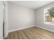 Bright bedroom with wood flooring and a large window providing natural light, creating a serene retreat at 4563 Townwall St, Las Vegas, NV 89115