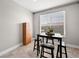 Inviting dining area bathed in sunlight with a modern table and chairs at 4563 Townwall St, Las Vegas, NV 89115