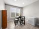 Cozy dining area with a table and chairs near the window. Natural light enhances the atmosphere at 4563 Townwall St, Las Vegas, NV 89115