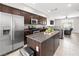 Well-equipped kitchen featuring an island, stainless steel appliances, and granite countertops at 4563 Townwall St, Las Vegas, NV 89115