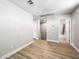 Living area showcasing neutral walls and wood-look laminate flooring at 4563 Townwall St, Las Vegas, NV 89115